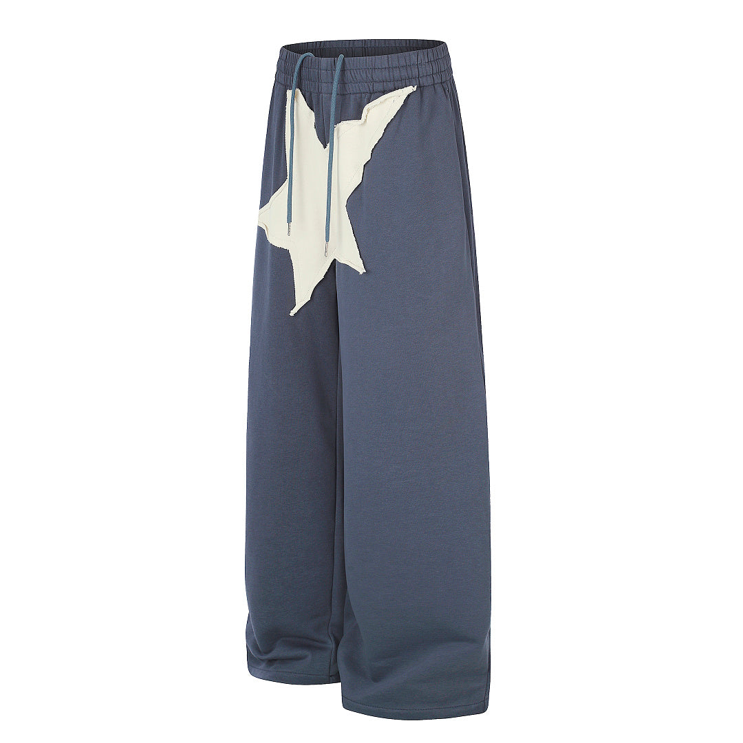 Wide leg sweatpants showing the relaxed oversized fit
