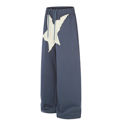 Wide leg sweatpants showing the relaxed oversized fit