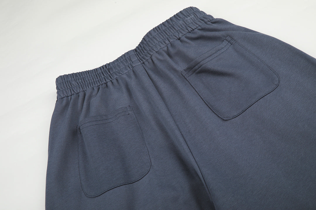 Full-length view of casual star appliqué sweatpants