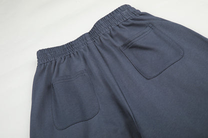 Full-length view of casual star appliqué sweatpants