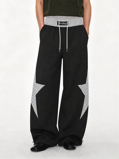 Baggy sweatpants featuring a star panel and layered waist