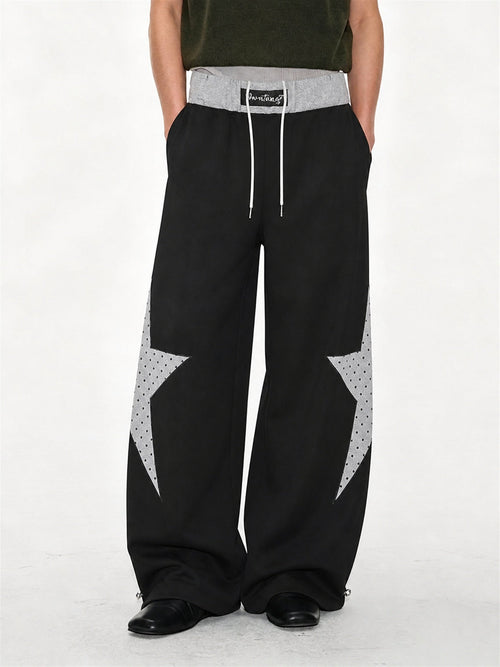 Baggy sweatpants featuring a star panel and layered waist