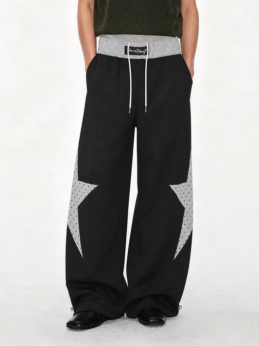 Baggy sweatpants featuring a star panel and layered waist