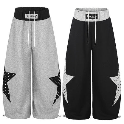 Side view showing the relaxed fit of star panel sweatpants