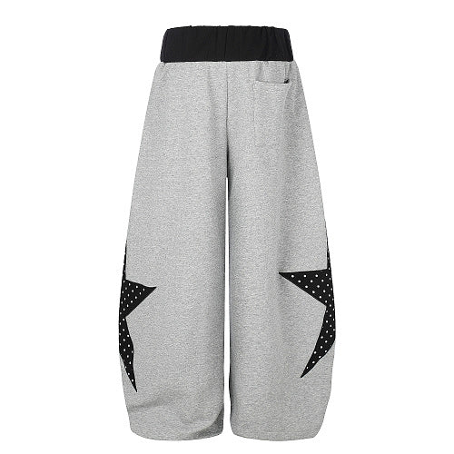Detailed view of the star panel design on the trouser leg