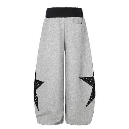 Detailed view of the star panel design on the trouser leg