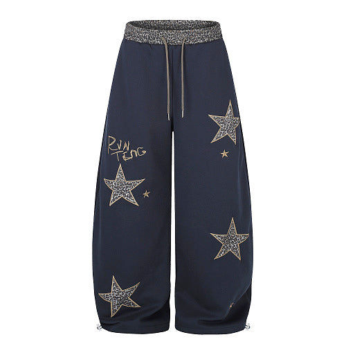 Front view of leopard star baggy sweatpants with a relaxed fit