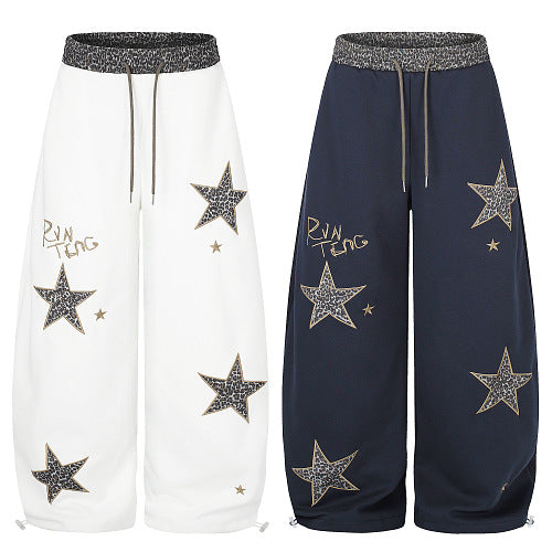 Baggy streetwear trousers with leopard and star detailing