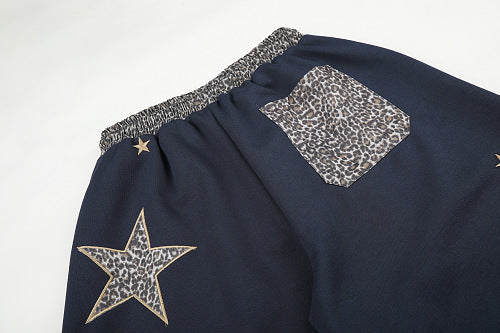 Side view showing the loose barrel-inspired shape of the sweatpants