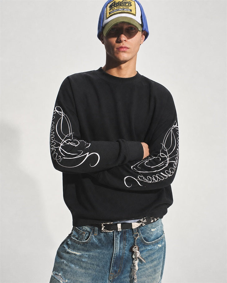 Leopard print embroidered long sleeve sweatshirt shown from the front
