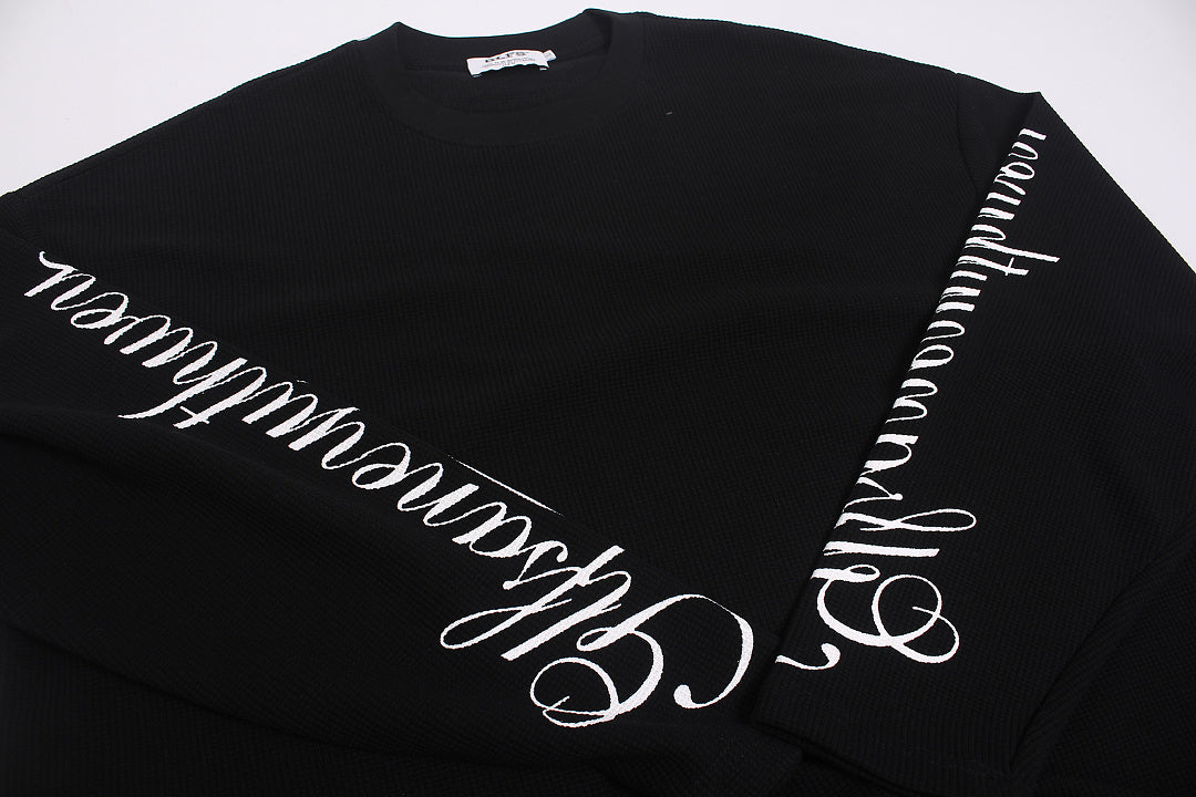Cuff and sleeve detail on the embroidered long sleeve sweatshirt