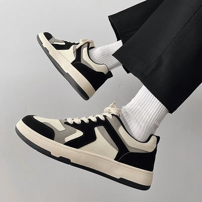 Pair of canvas trainers shown from the side with breathable fabric uppers