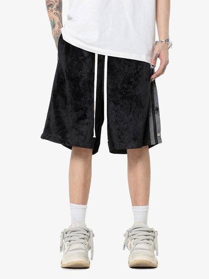 Waistband detail of suede athletic shorts