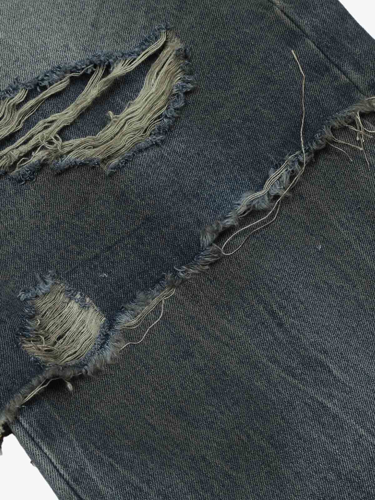 Close-up of the high waistband and fastening on the jeans