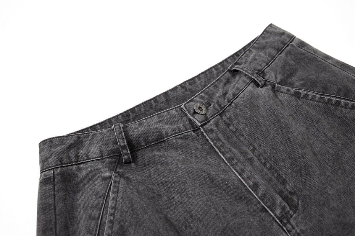 Close-up of cargo trouser fabric with a washed cotton finish