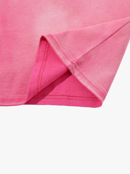 Folded oversized washed cotton T-shirt highlighting the faded finish