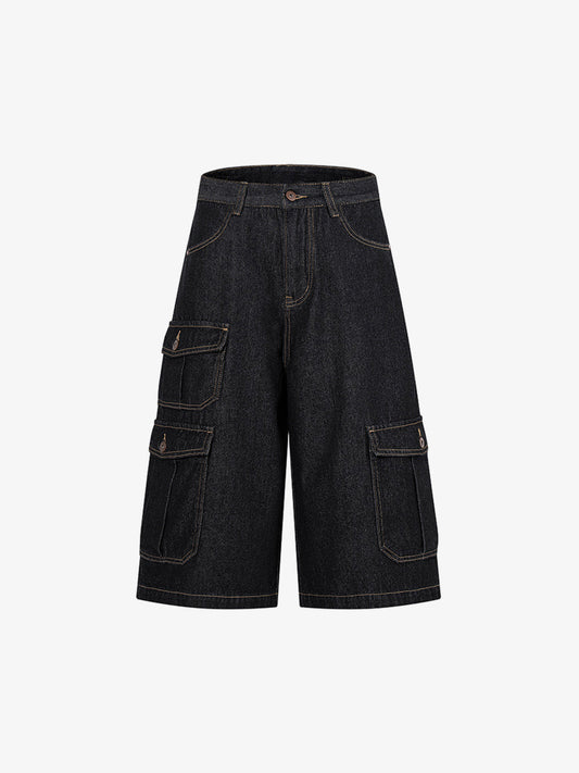 Front view of dark wash denim shorts with adjustable waist tabs
