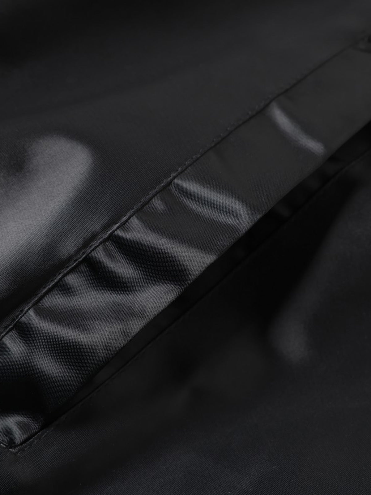 Embroidered varsity jacket styled as a versatile streetwear layer