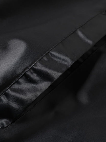 Embroidered varsity jacket styled as a versatile streetwear layer