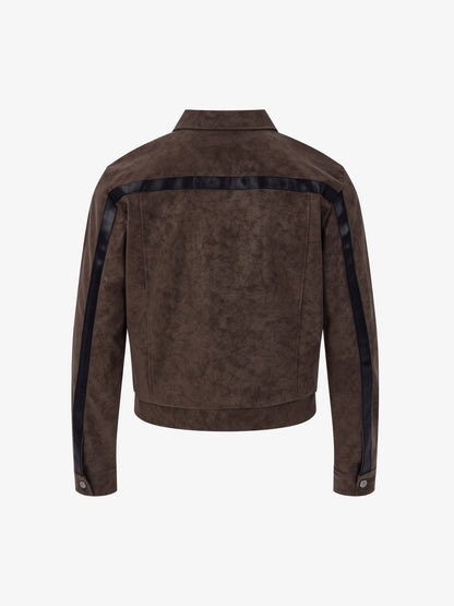 Brown cropped faux leather jacket showing its deconstructed patchwork front