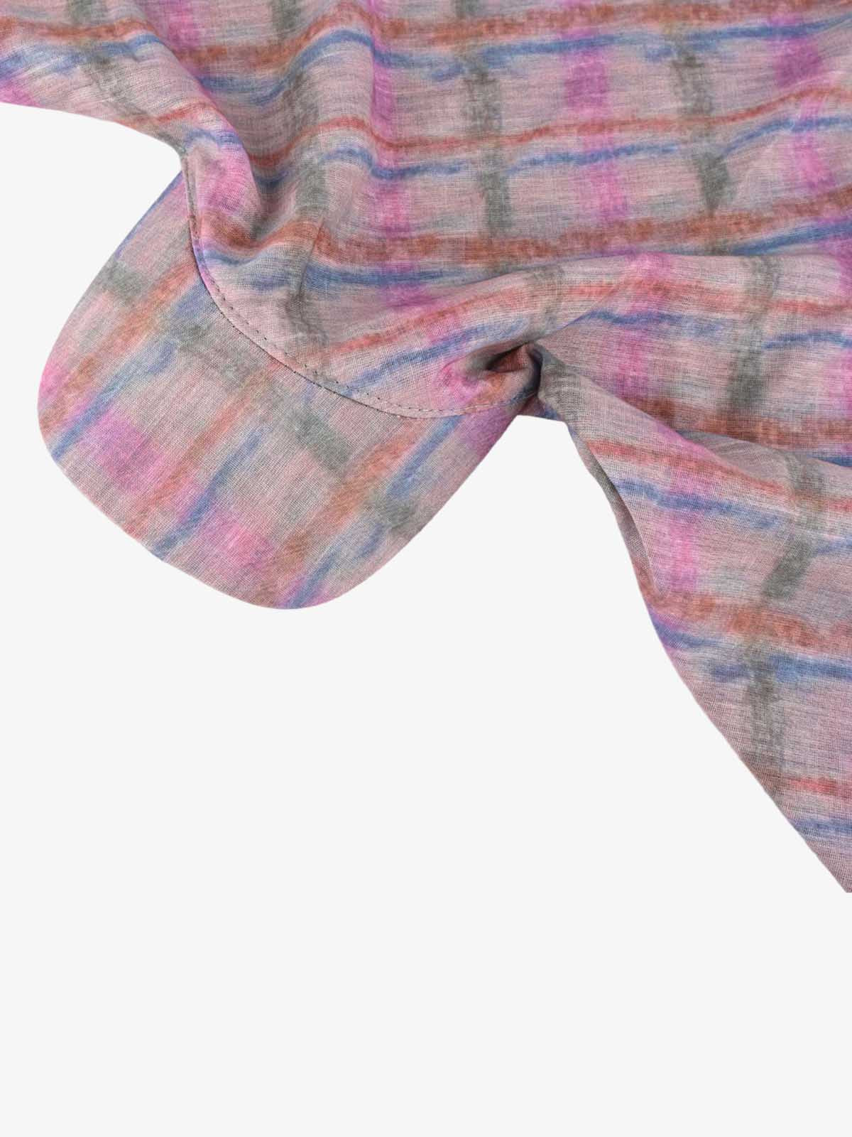 Angled view of the colourful tie-dye cap styled for everyday casual wear