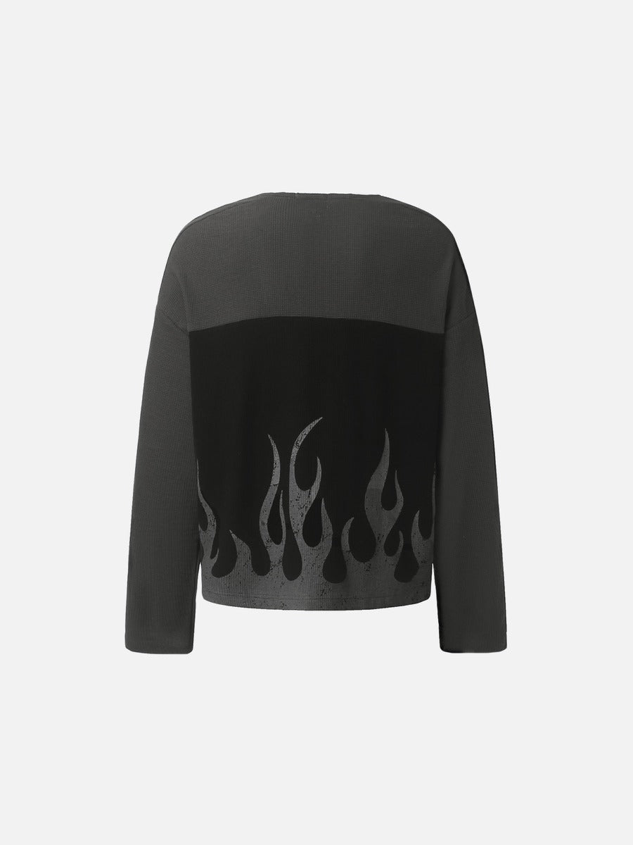 Detail view of the neckline and 87 flame graphic top