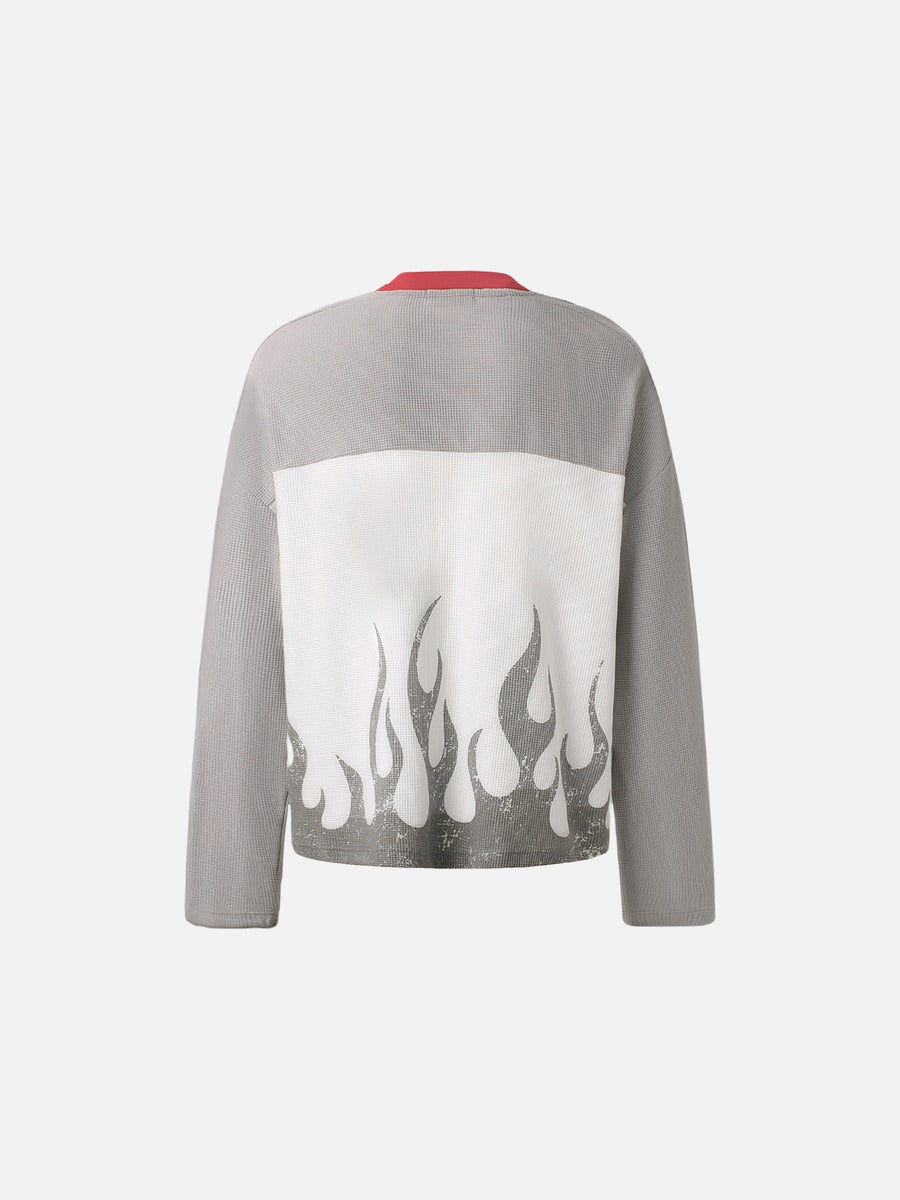 Side view of the 87 flame graphic long-sleeve top