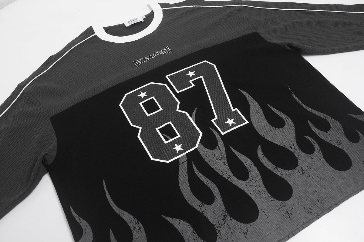 Full product view of the 87 flame graphic long-sleeve top