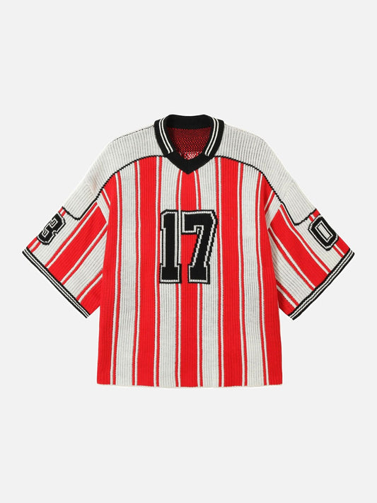 Front view of graphic V-neck knit top in black, red and white