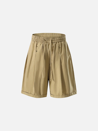 Rear view of wide-leg studded shorts with stud detailing