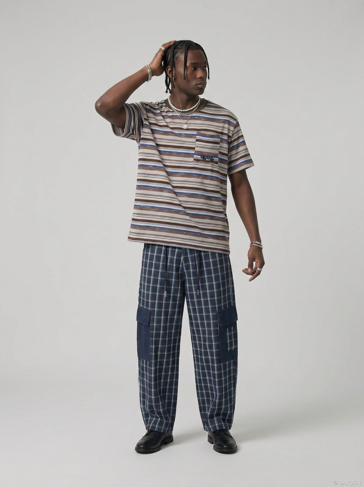 Model wearing textured striped tee styled casually, side view