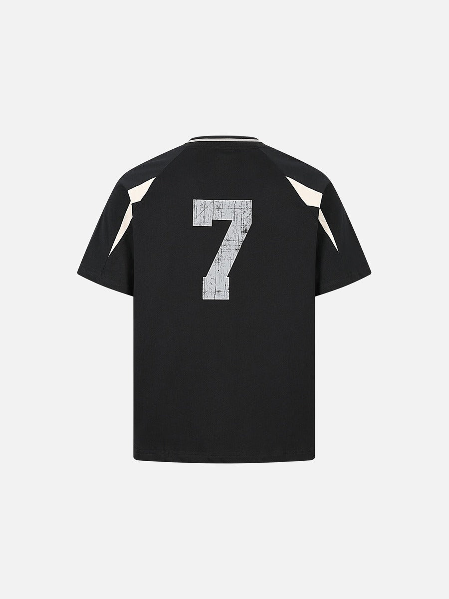 Detail view of hem and fit on relaxed fit raglan T-shirt