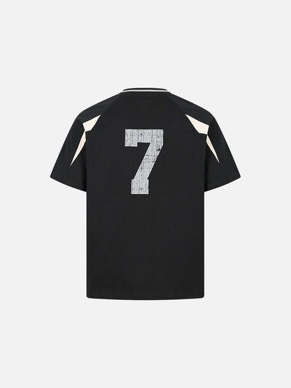 Detail view of hem and fit on relaxed fit raglan T-shirt