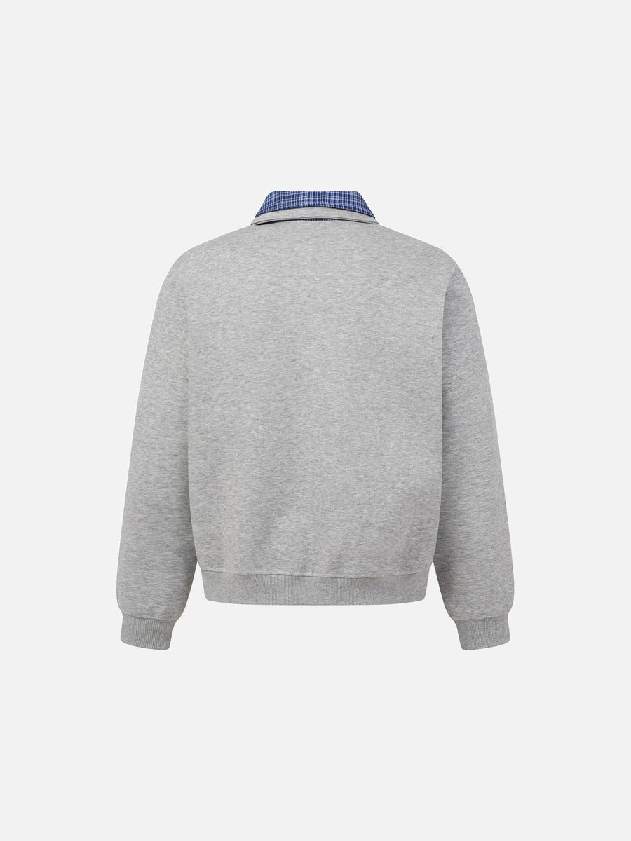 Front detail of the collar and neckline on the sweatshirt