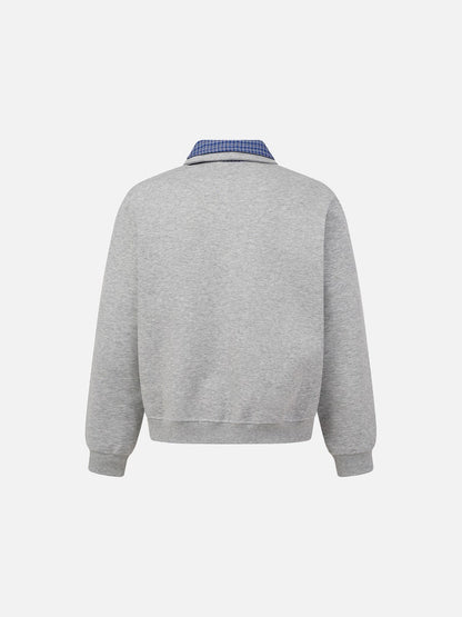 Front detail of the collar and neckline on the sweatshirt
