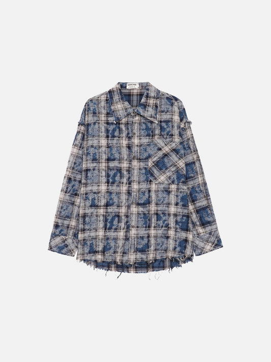 Front view of oversized blue plaid shirt with distressed finish