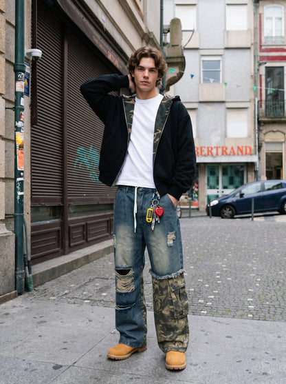 Distressed camouflage wide-leg jeans shown from the front