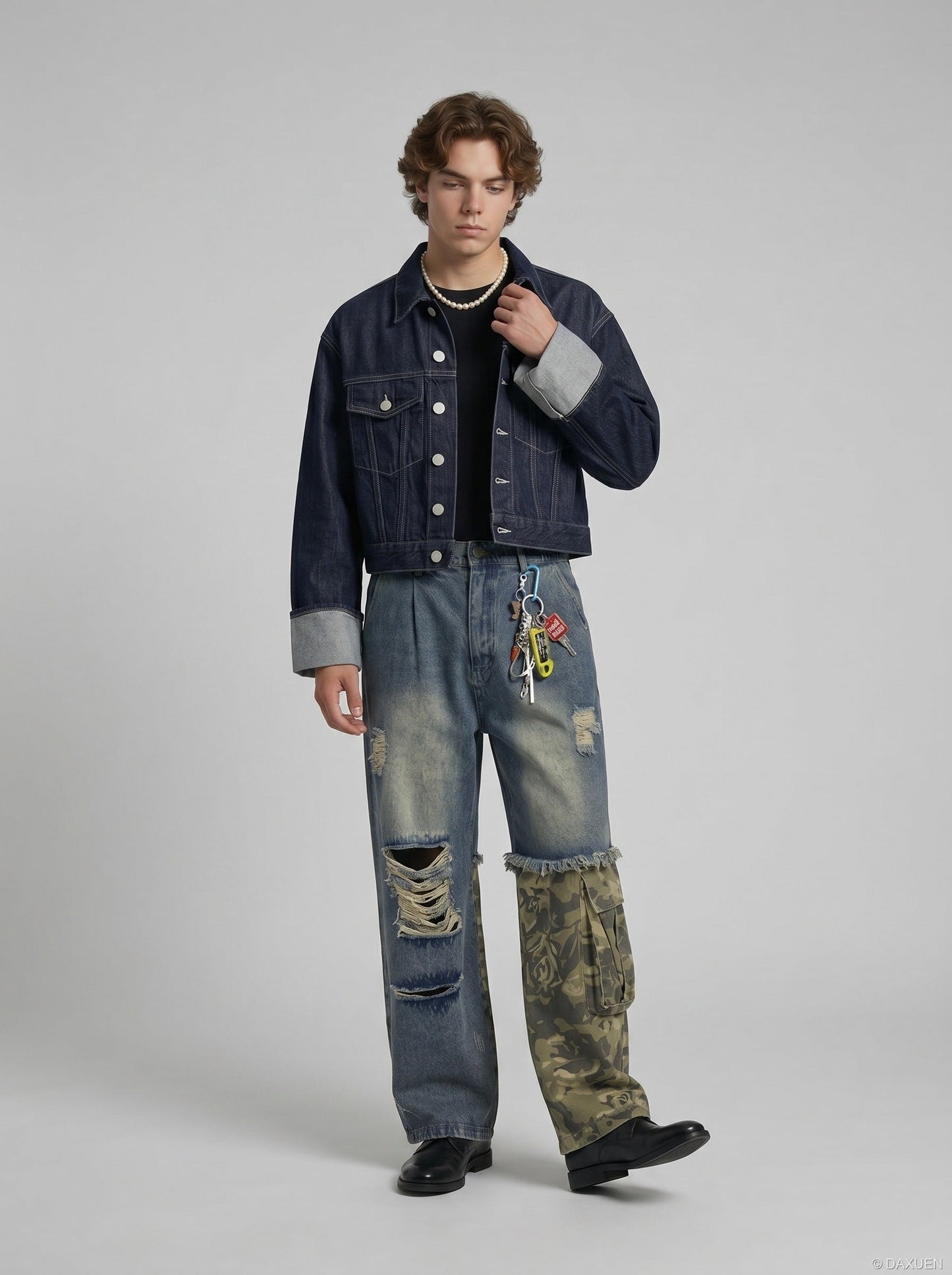 Full-length view of casual distressed camouflage jeans