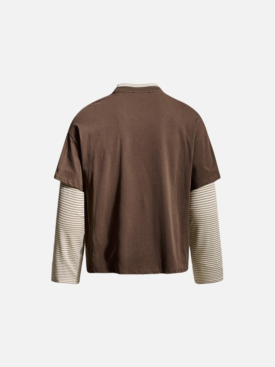 Angled view of distressed pink block graphic layered tee