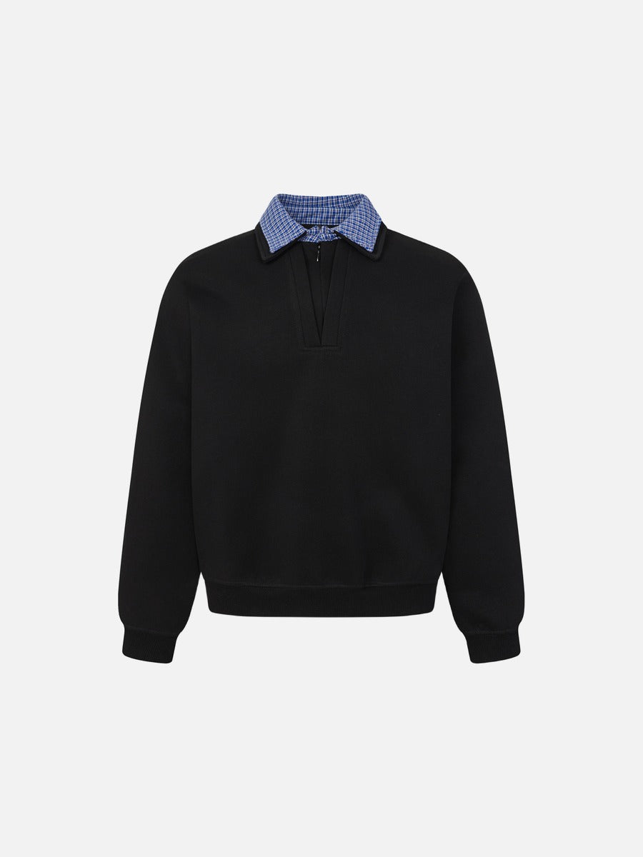 Close-up of the contrasting plaid collar on the sweatshirt