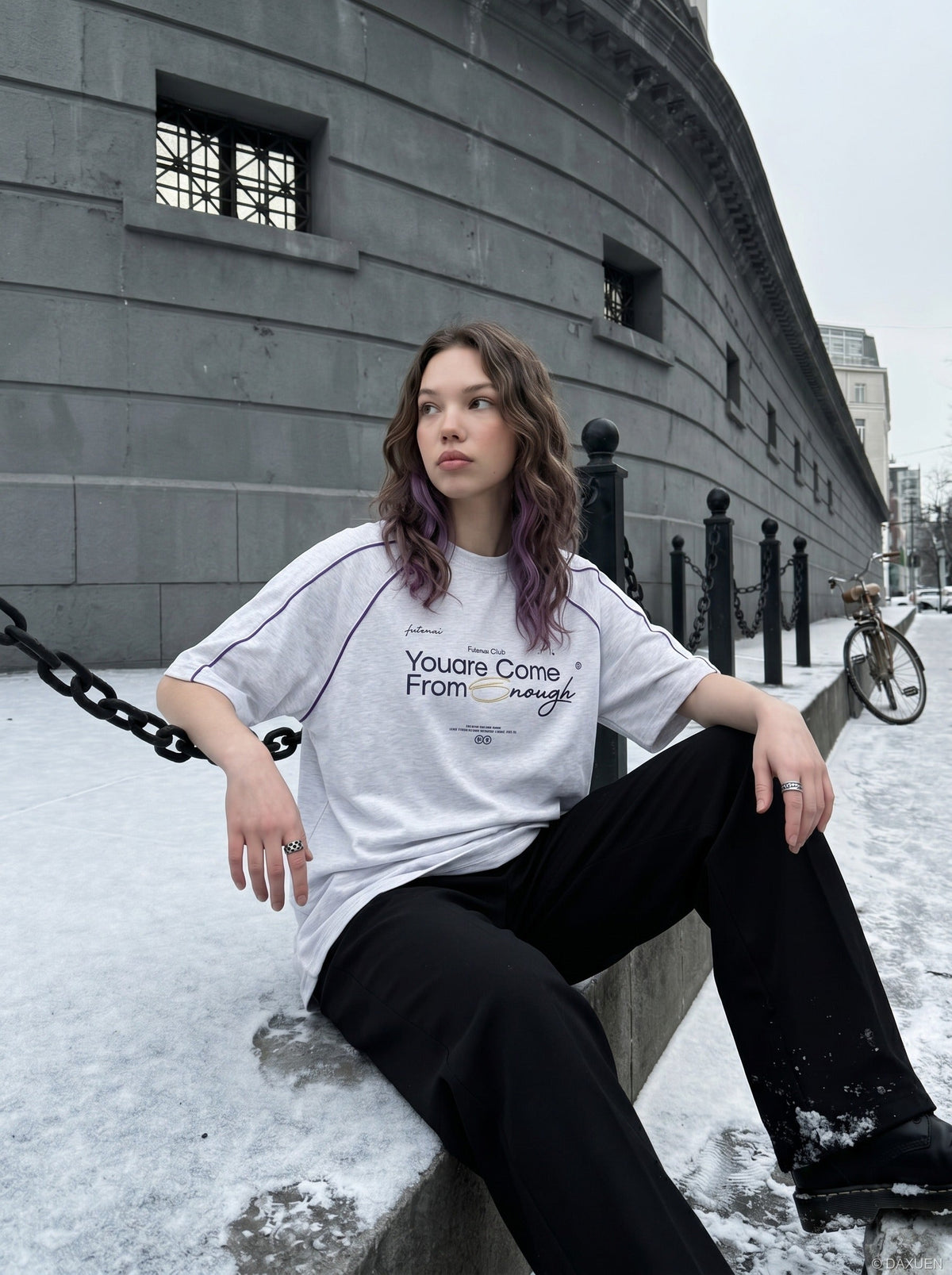 Full-length view of oversized graphic T-shirt outfit