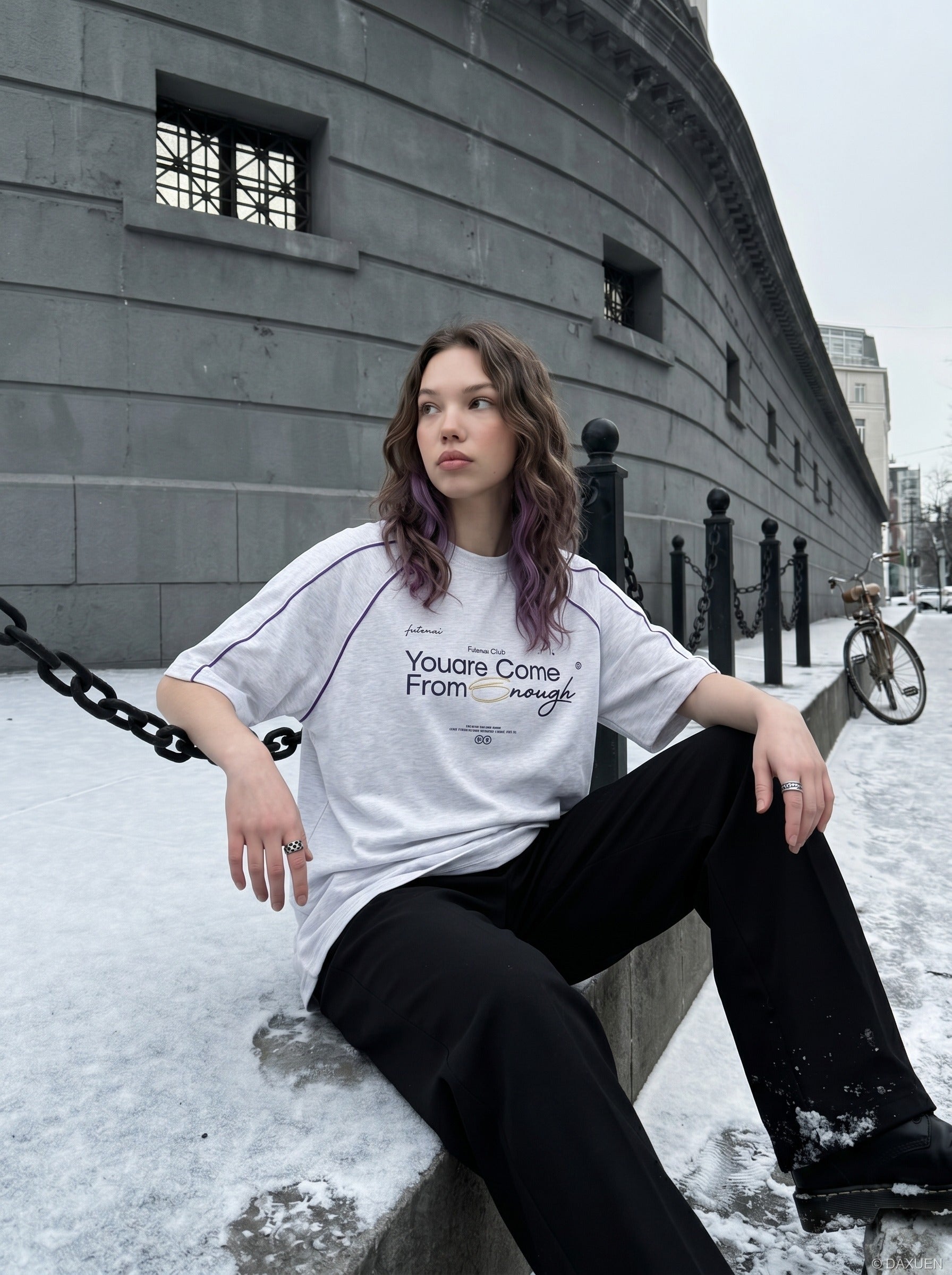 Full-length view of oversized graphic T-shirt outfit