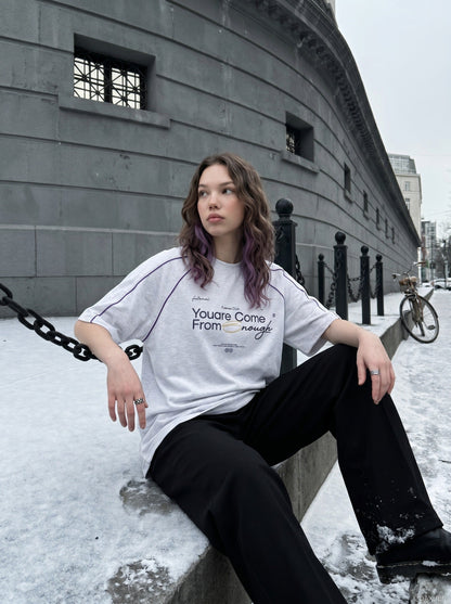 Full-length view of oversized graphic T-shirt outfit