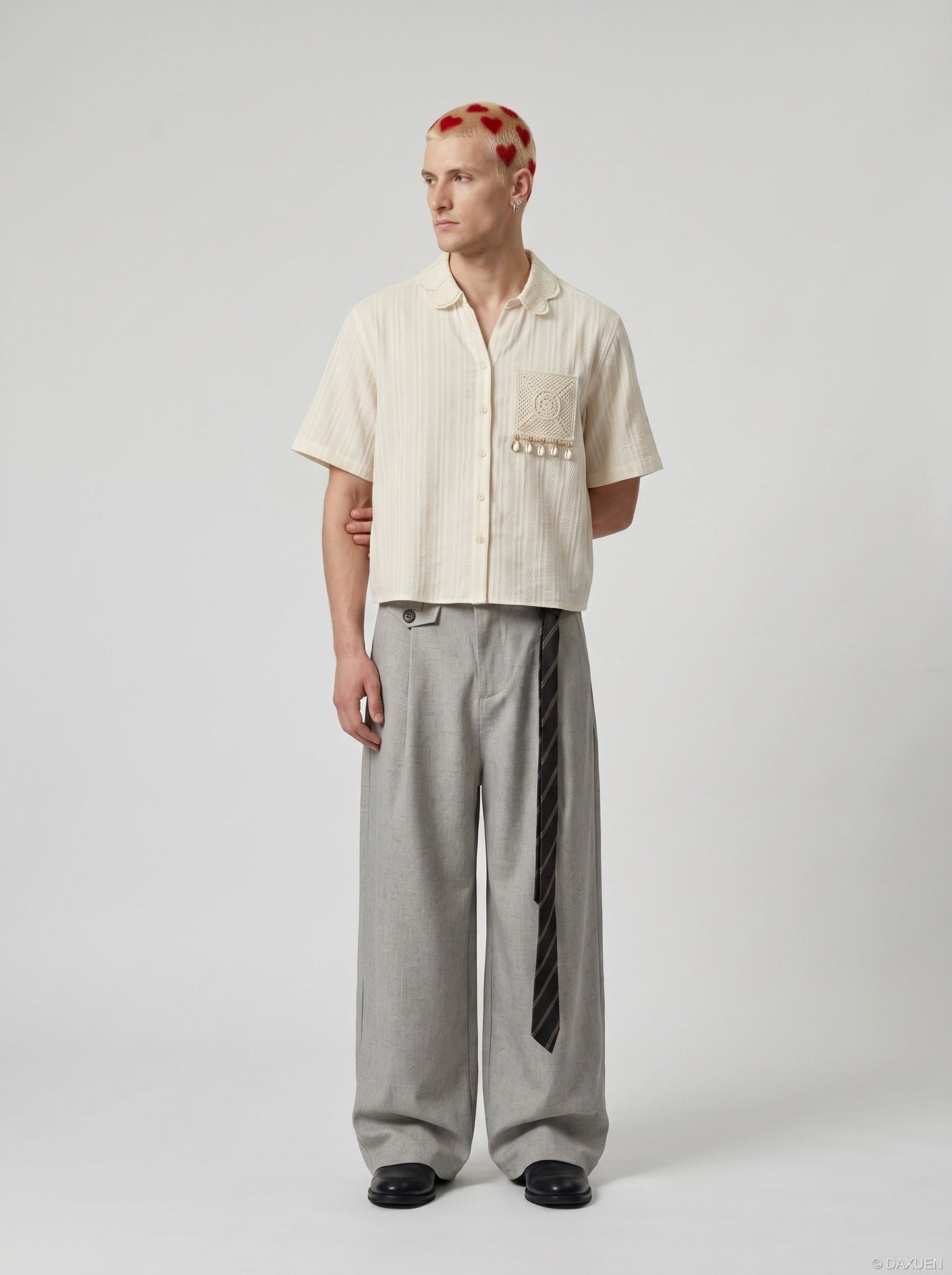 Rear angled view of embroidered short sleeve shirt on model