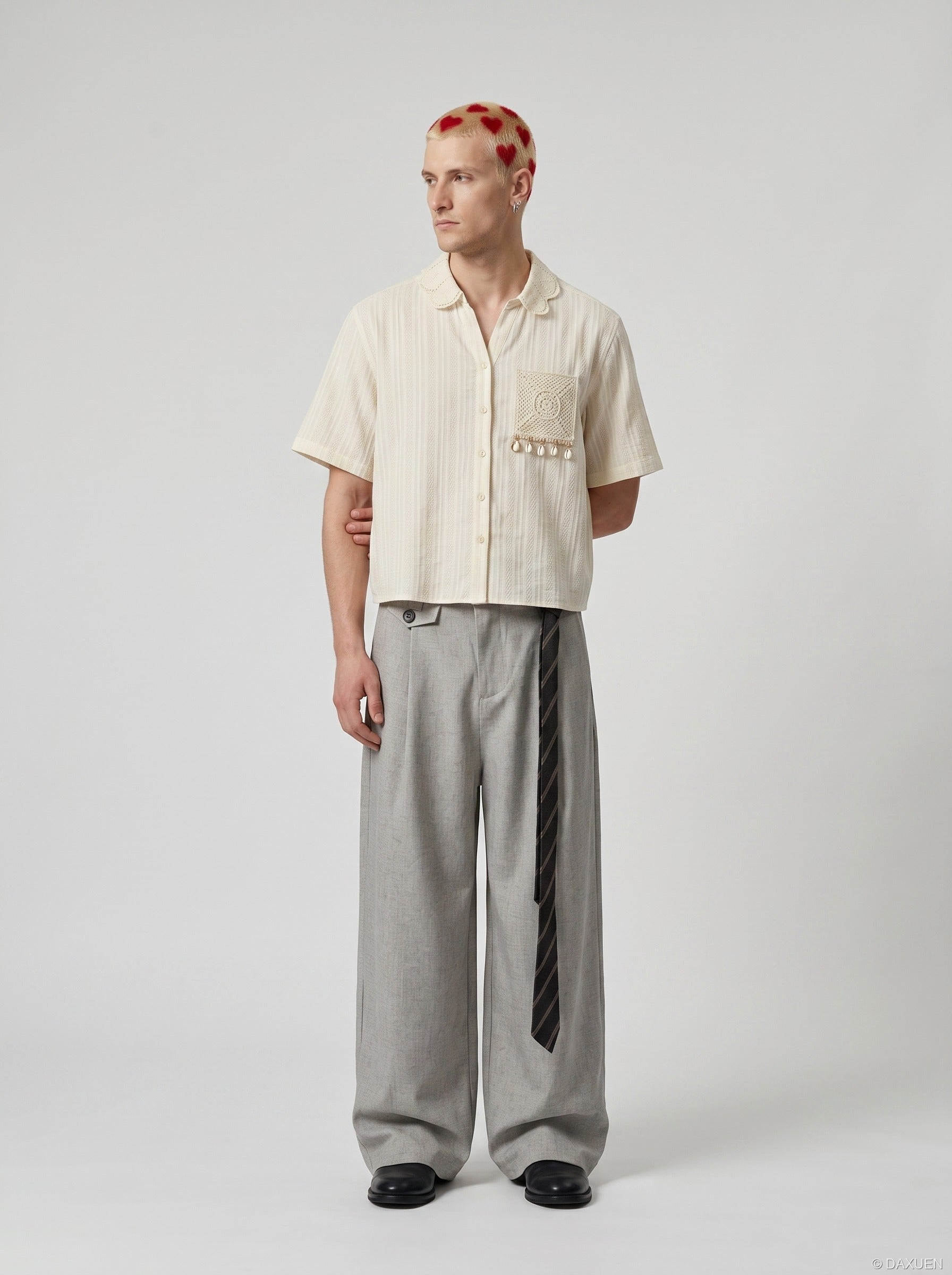 Rear angled view of embroidered short sleeve shirt on model
