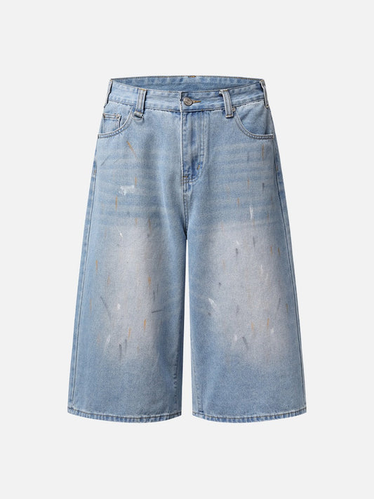 Paint splatter denim culotte shorts in faded light blue shown from the front