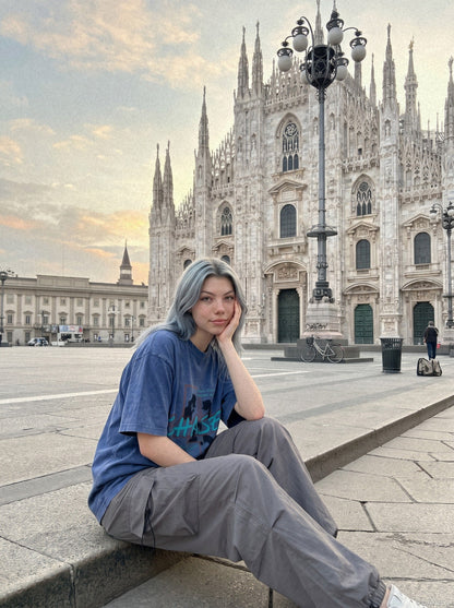 Model wearing oversized graphic T-shirt with faded pixel print