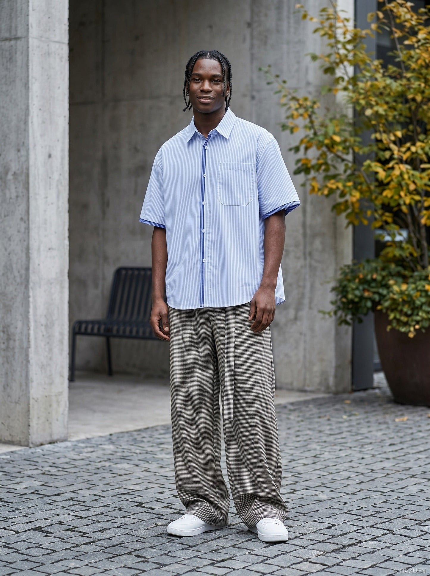 Striped button-up shirt shown on model from the back