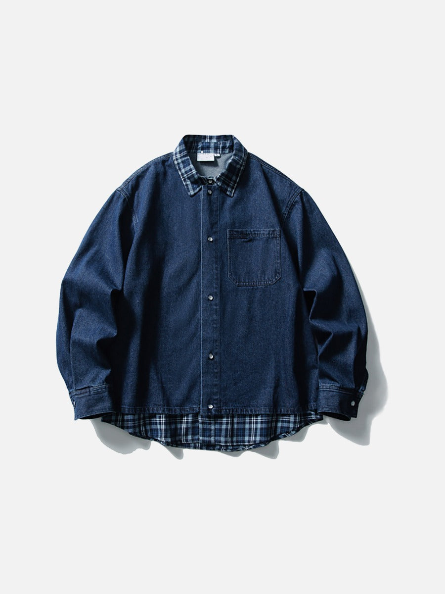 Three-quarter view of layered denim shirt with blue plaid detail