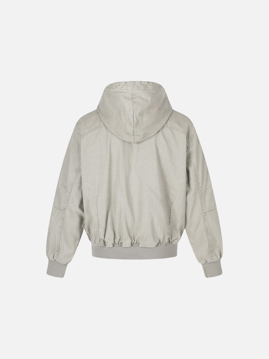 Light grey washed cotton bomber jacket laid flat